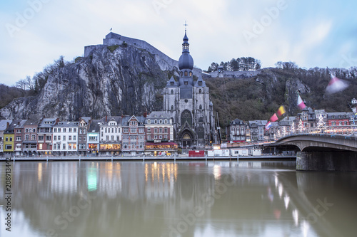 Dinant cityscape, Belgium. Collegiate Church of Our Lady near Meuse river.