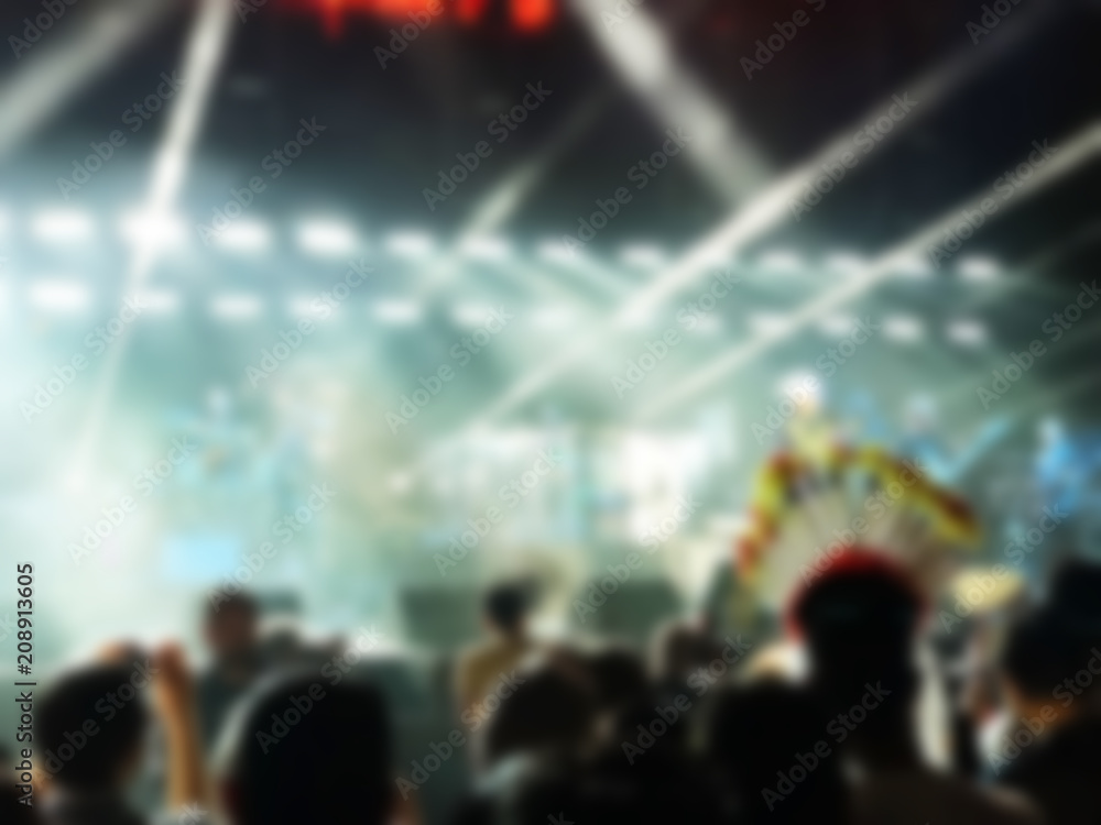 Blurred abstract background. Bokeh lighting in concert with audience.