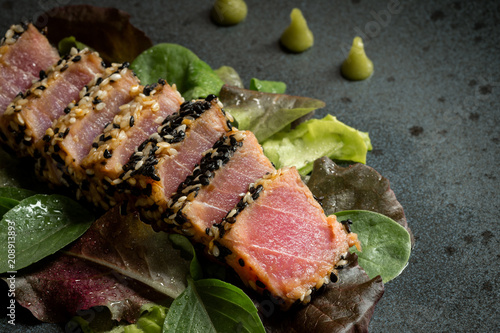 Grilled Sliced Tuna Steak in Sesame with Salad and Wasabi Sauce