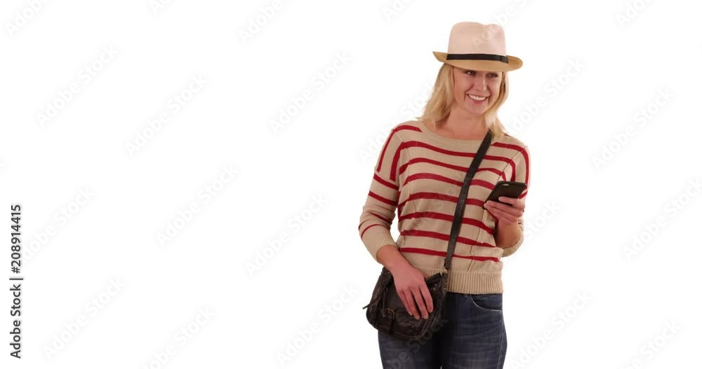 Portrait of happy blonde female hipster using phone on solid white copy space, Smiling hip white woman with smartphone having good time on white background, 4k Portrait of happy blonde female hipster using phone on solid white copy space, Smiling hip white woman with smartphone having good time on white background, 4k