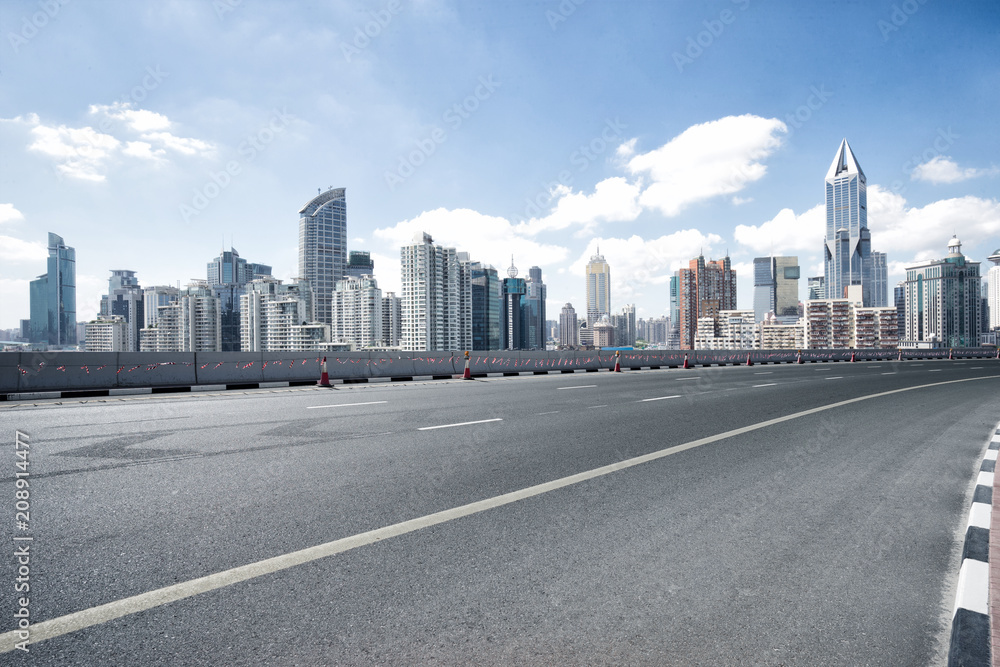 empty road with city skyline