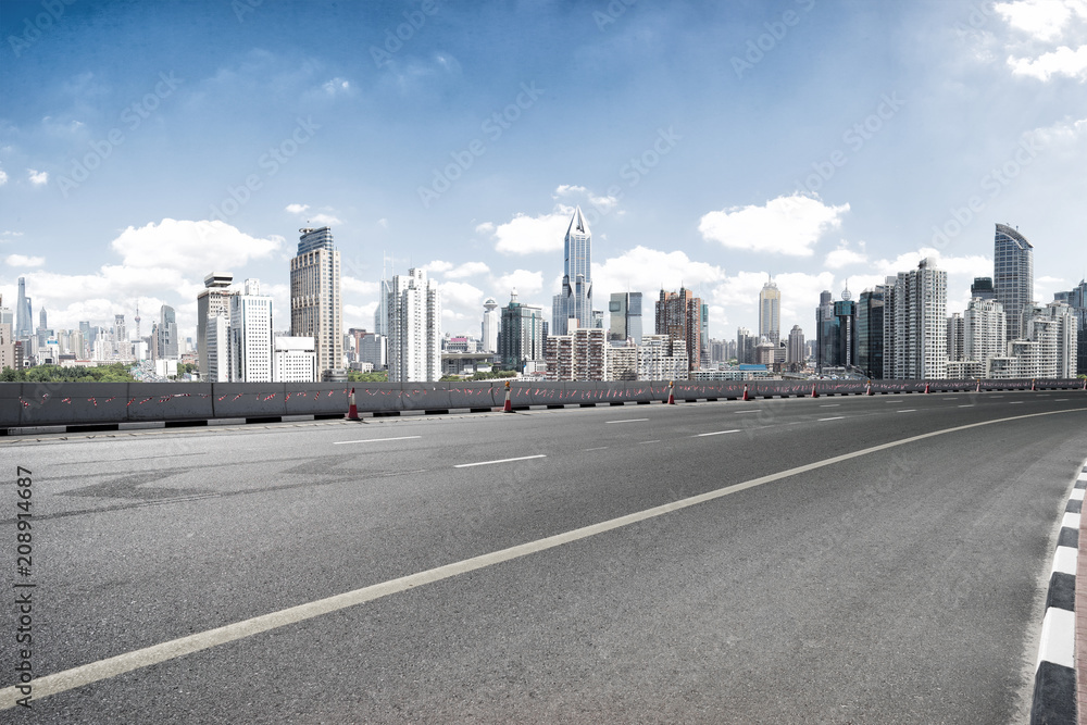 empty road with city skyline