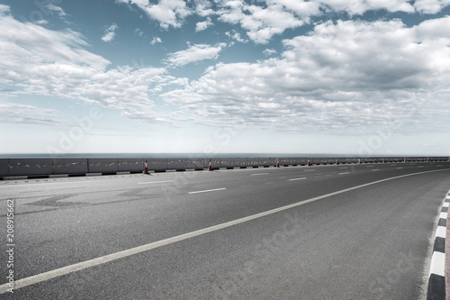 empty asphalt road with landscape © zhu difeng