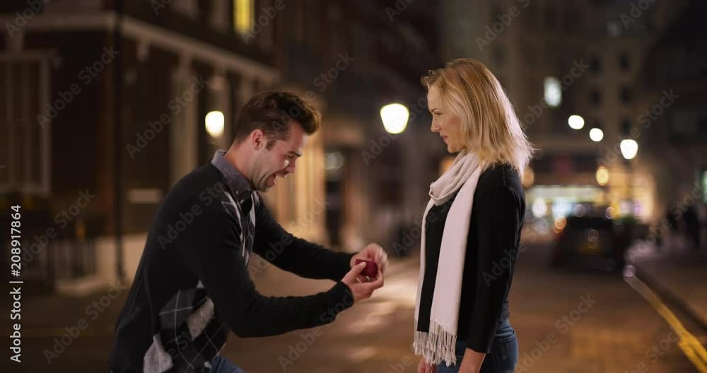 Handsome man proposes to his girlfriend outdoors, Joyful couple get engaged, 4k Handsome man proposes to his girlfriend outdoors, Joyful couple get engaged, 4k