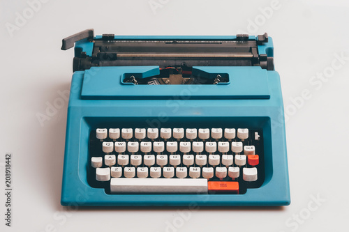 Close up typewriter on white background.