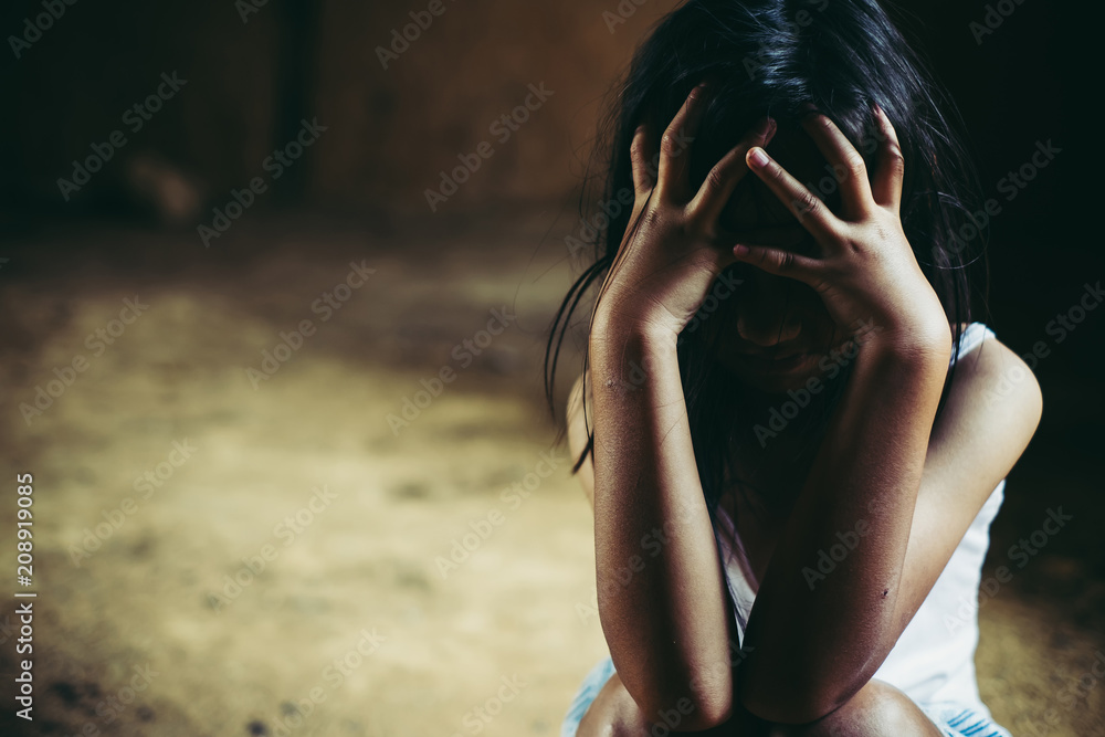 Little sad girl hiding or locked in the basement. trafficked and abused  Stock Photo | Adobe Stock