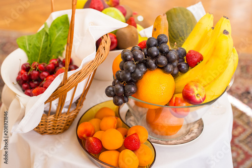 Decoration with ripe delicious fruits on white table