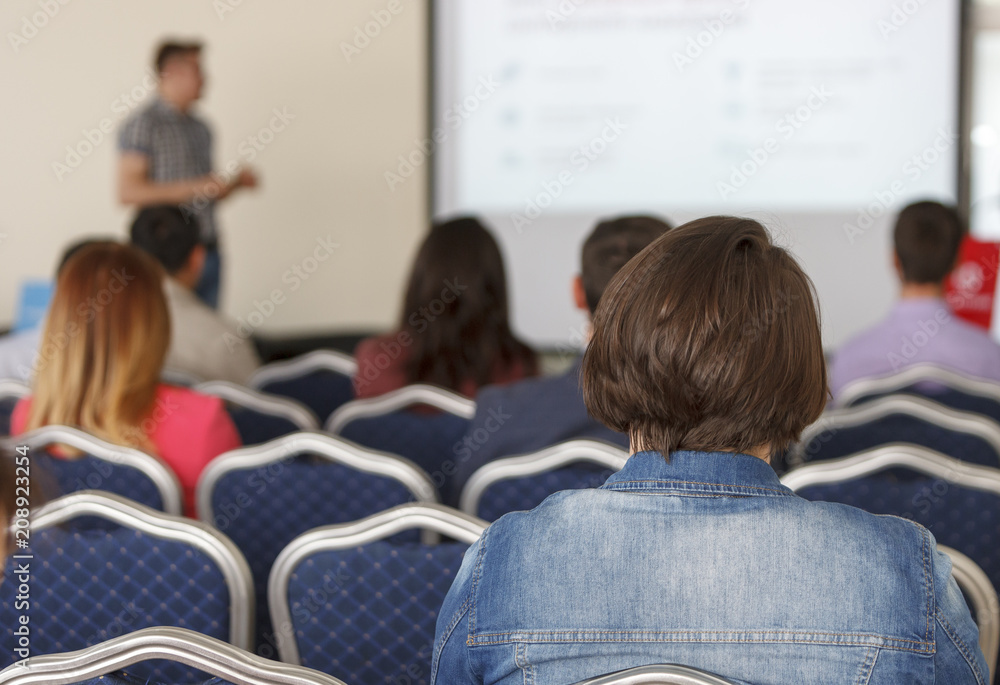 Speaker at a business conference and presentation. Speaker at a business conference and presentation.
