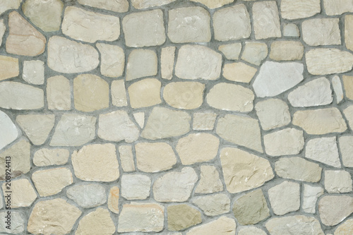 Wall of natural gray stone. Close up