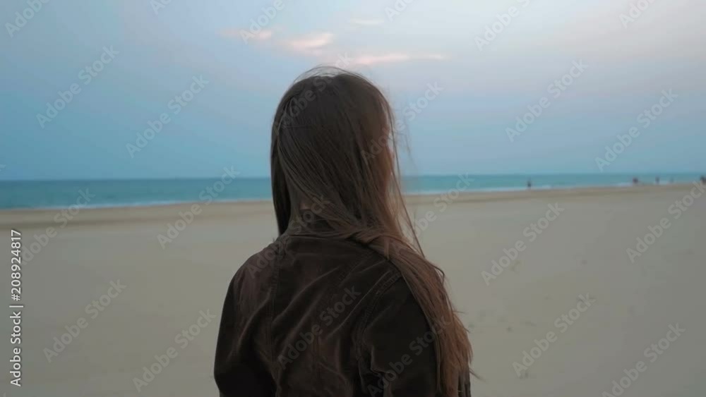 Portrait of a happy young girl on the coastline of the summer sea. Close up shot. Portrait of a happy young girl on the coastline of the summer sea. Close up shot.