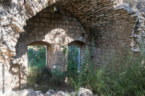 Ruins  of abandoned Palestinian village Kafr Birim in the north of Israel in which the christians Maronites lived until the middle of the 20th century photo