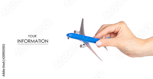 Miniature airplane in hand travel pattern on white background isolation