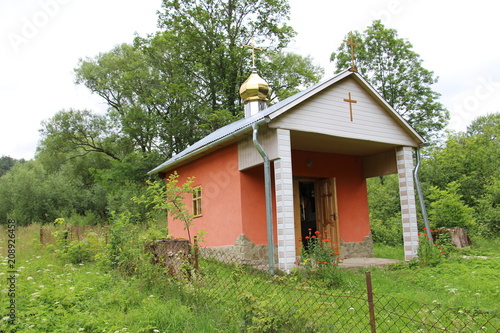 The building of a small Orthodox chapel in the Carpathian mountains in Ukraine