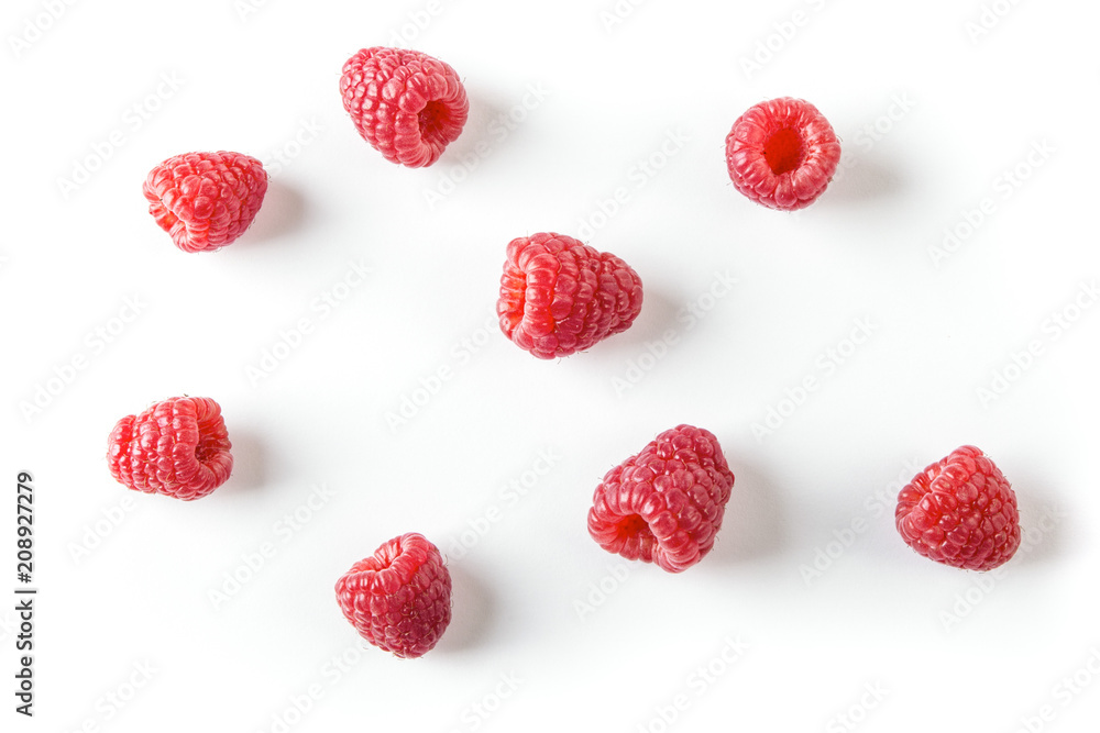 Scattered Raspberries on White Background Top View Scattered Raspberries on White Background Top View