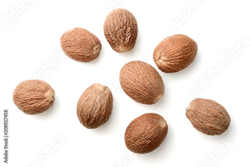 dried nutmeg isolated on white, top view photo