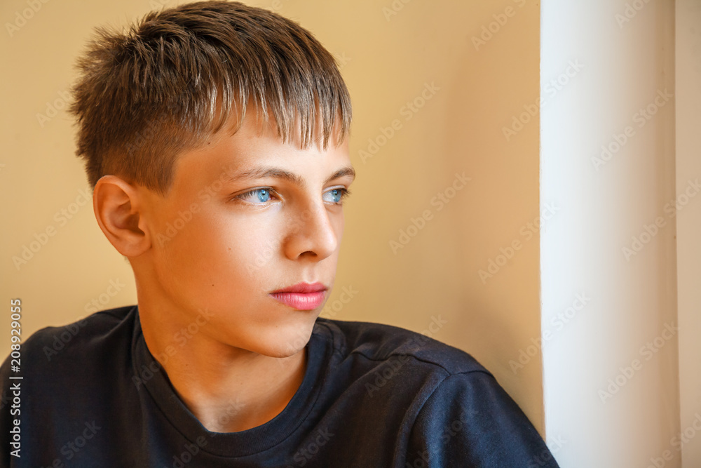 portrait of a guy looking out the window. portrait of a guy looking out the window.