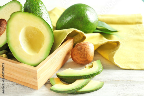 Fresh sliced avocado on table photo