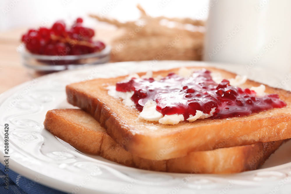 Tasty toasts with sweet jam on plate, closeup