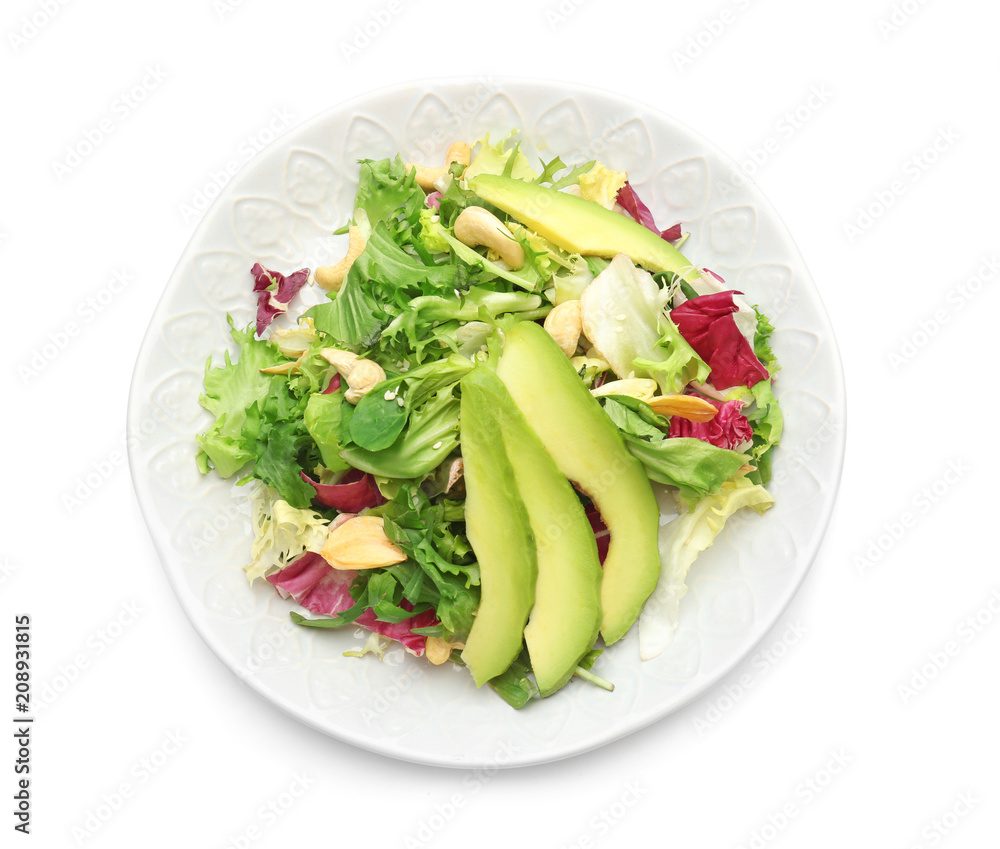 Plate of tasty salad with ripe avocado on white background Plate of tasty salad with ripe avocado on white background