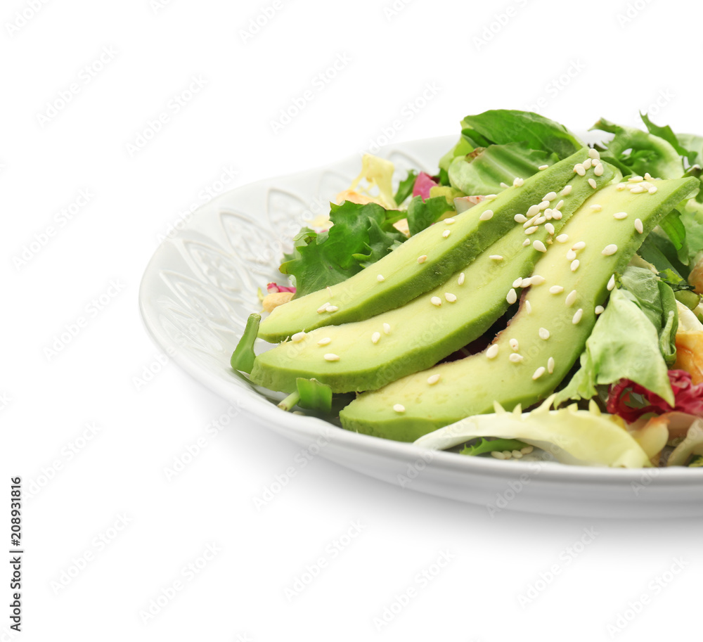 Plate of tasty salad with ripe avocado on white background, closeup