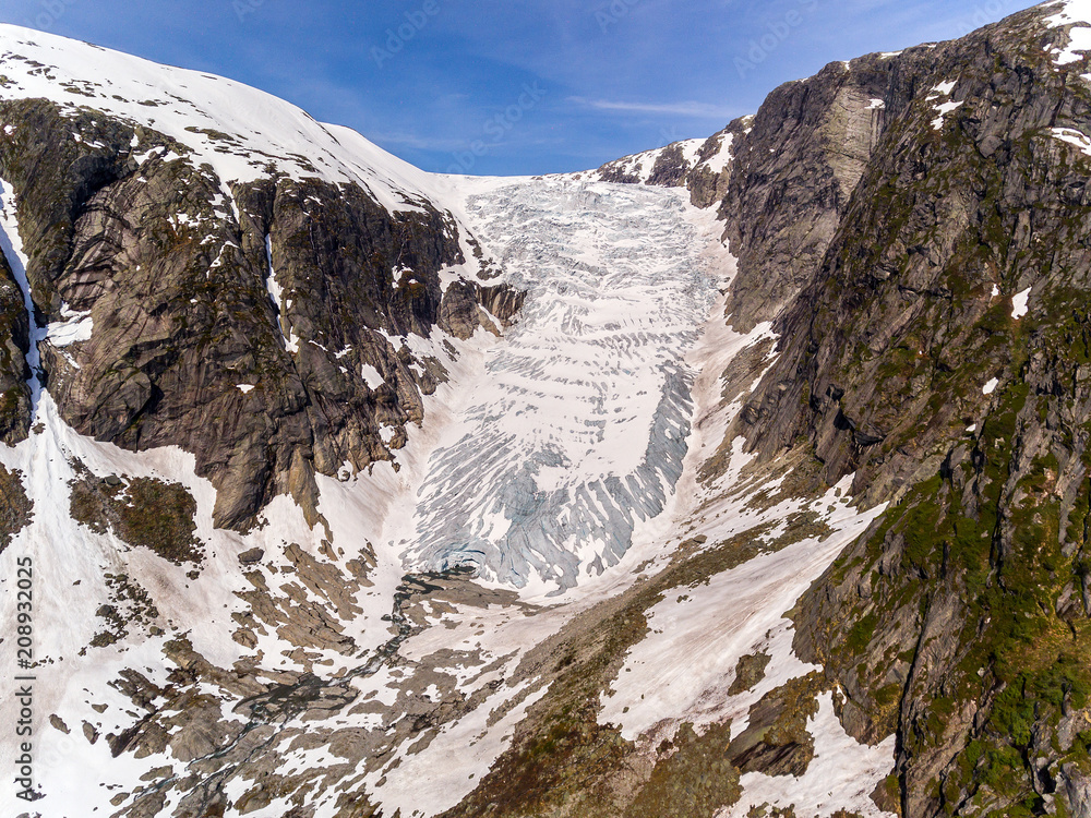 Photo of Tuftebreen - glacier in Norway is nearby to Steinmannen and Bakli. Aerial view.