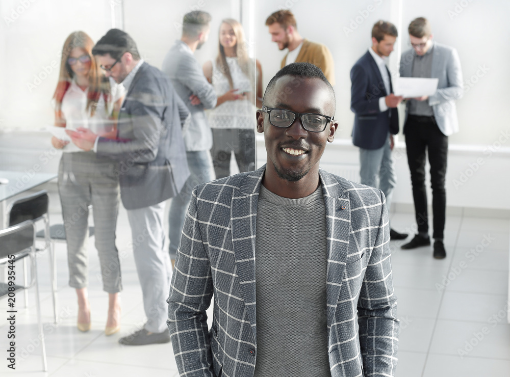 businessman standing in the hall of the modern office