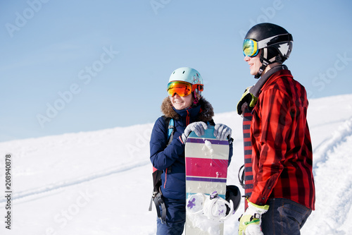 Image of sports woman and man with snowboard on vacation