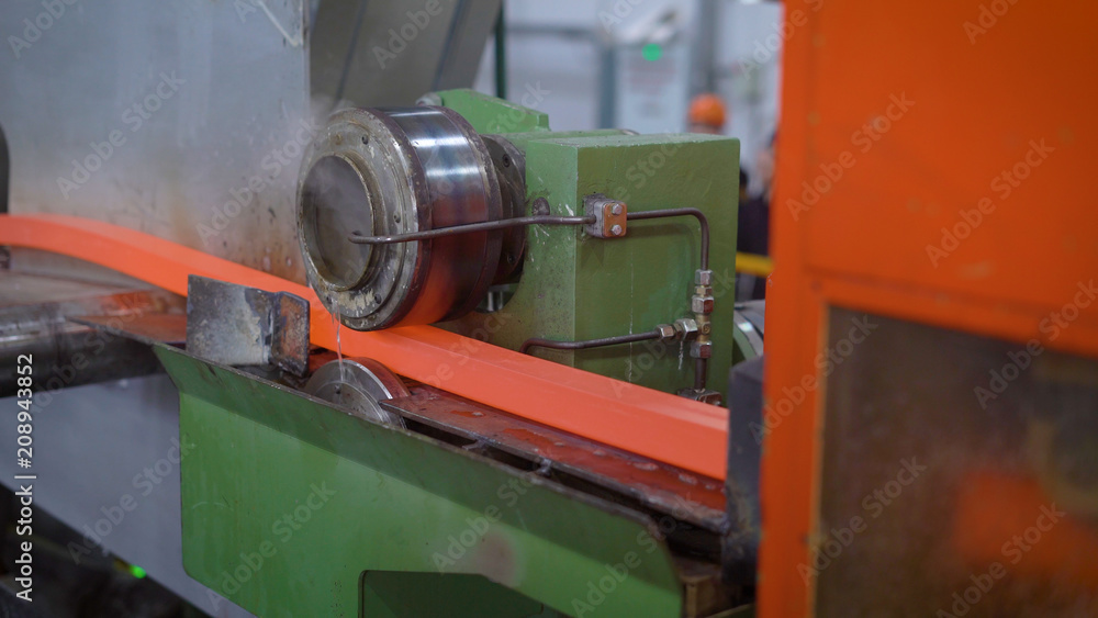 In the frame, red-hot metal on the rental line. The section of the future rolling is formed successively by special rollers.