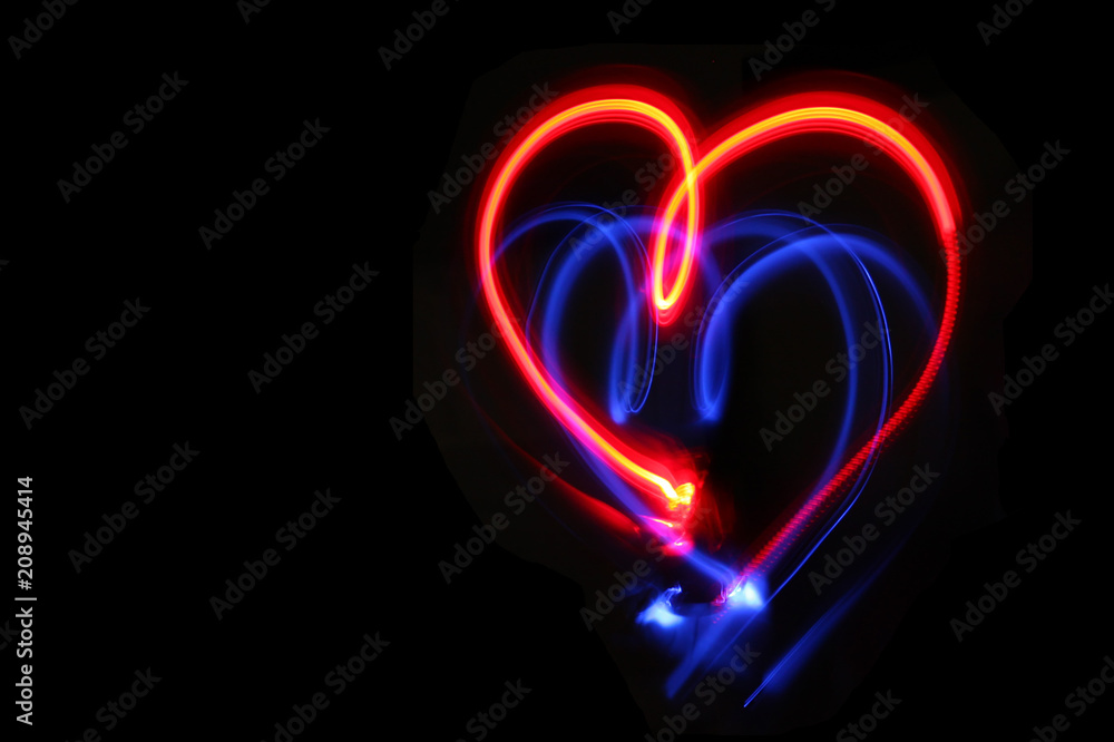 Heart drawn with red and blue lights.