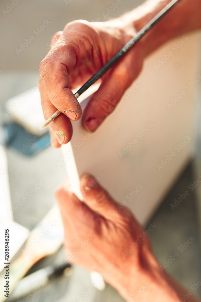 Close up man working of Architect sketching a construction project on his plane project at site construction work Close up man working of Architect sketching a construction project on his plane project at site construction work