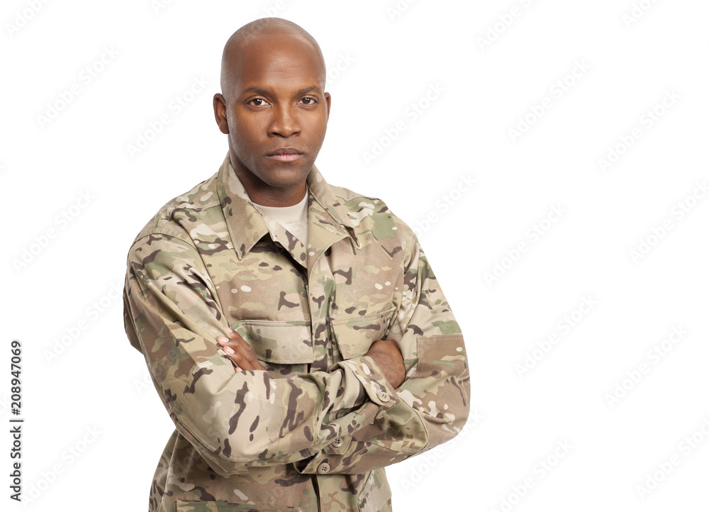 Serious Looking Army Serviceman With Arms Crossed