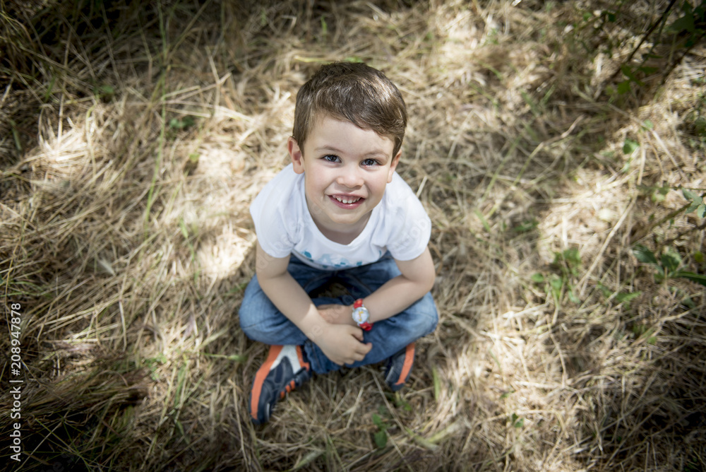 Little boy posing in the park Little boy posing in the park