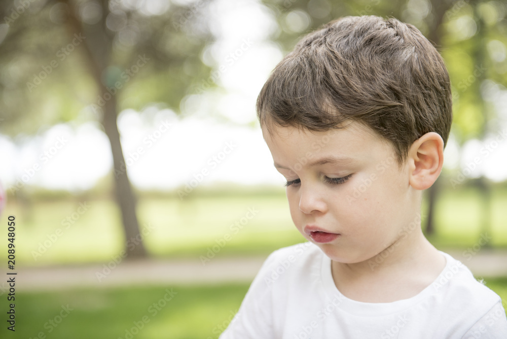 Little boy posing in the park Little boy posing in the park