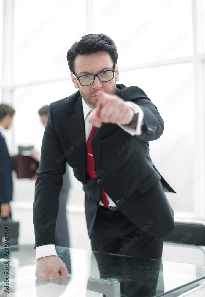 strict business owner pointing finger at you. strict business owner pointing finger at you.
