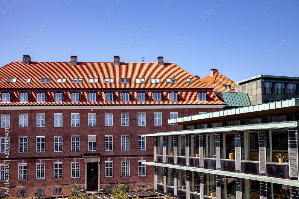 Urban scene with blue sky and buildings in Copenhagen, Denmark
