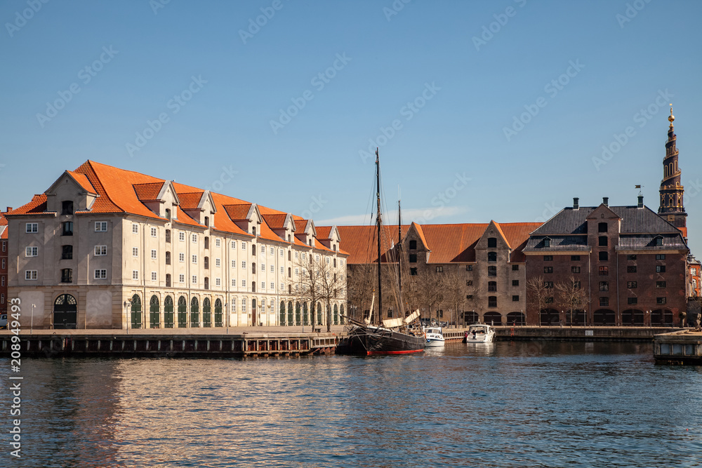 COPENHAGEN, DENMARK - MAY 6, 2018: historical buildings and boats moored in harbor, copenhagen, denmark