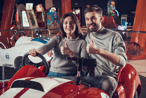 Happy parents in amusement park photo