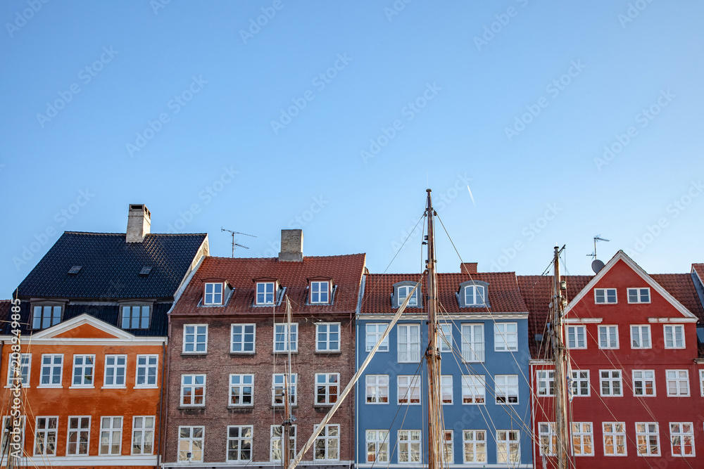 beautiful colorful historical buildings against blue sky in copenhagen, denmark