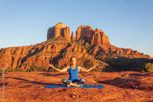 Woman Practicing Yoga in the Red Rocks of Sedoan