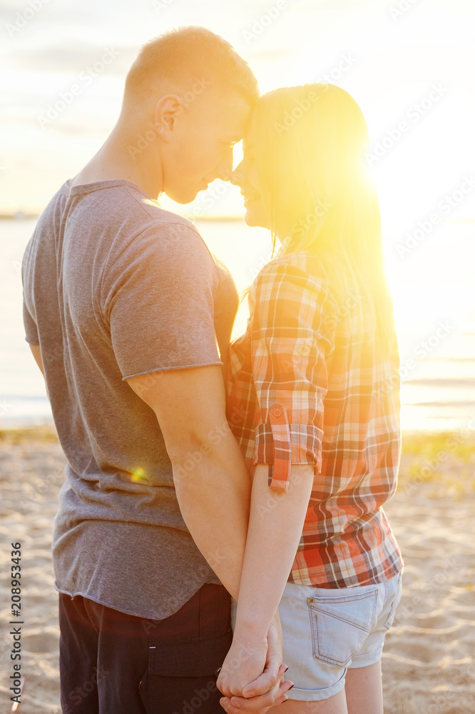 Fototapeta premium couple happy on the beach sunset romantic kiss close-up