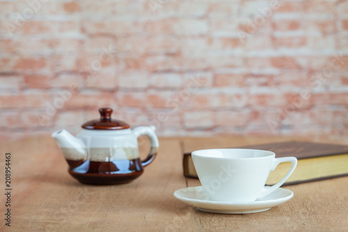 white coffee cup for refreshment on wood table.