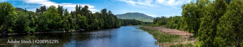 Panoramic view of a summer scene with river near Lake Placid