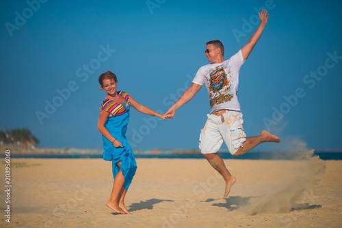 Man and woman jumped on the beach