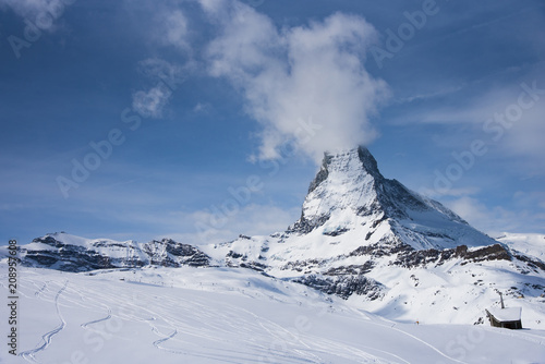 The famous mountain Matterhorn peak with cloudy and blue sky from Gornergrat  Zermatt  Switzerland