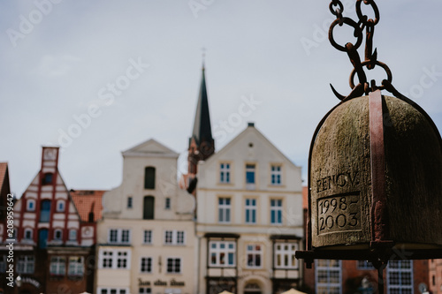 Close up of old Crane weight in front of historical building facade in Harbor Lueneburg, Lower Saxony,Germany photo