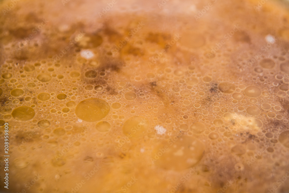 Obraz premium Disgusting liquid from fat and water after cooking