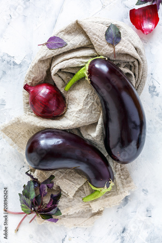 Purple eggplant, basil and red onion.