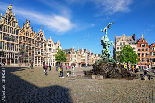 Antwerp, Belgium-MAY 02, 2018: Brabo fountain on Grote Markt (Market square) with traditional Flemish architecture. It is a main square in the city and one of the main attractions in the city photo