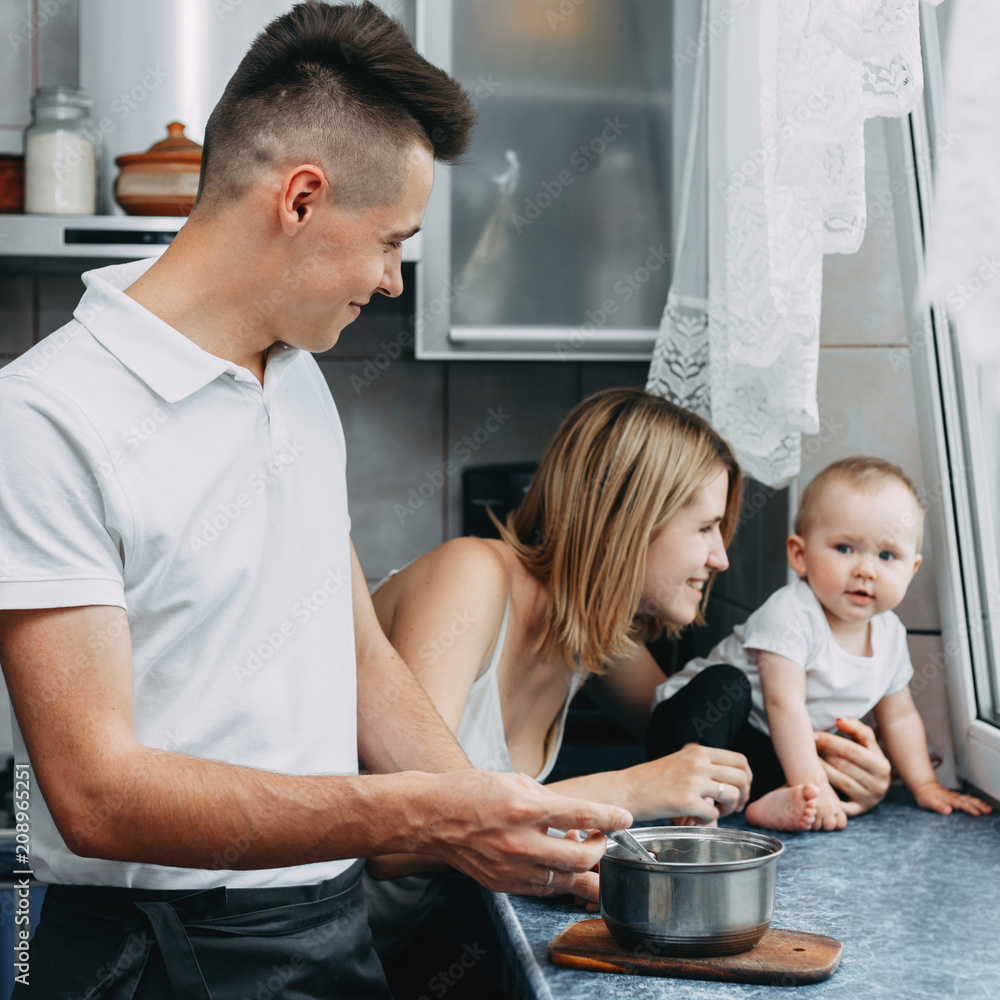 Parents feeding their toddler daughter Parents feeding their toddler daughter
