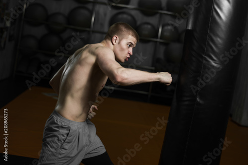 fighter training with a punching bag